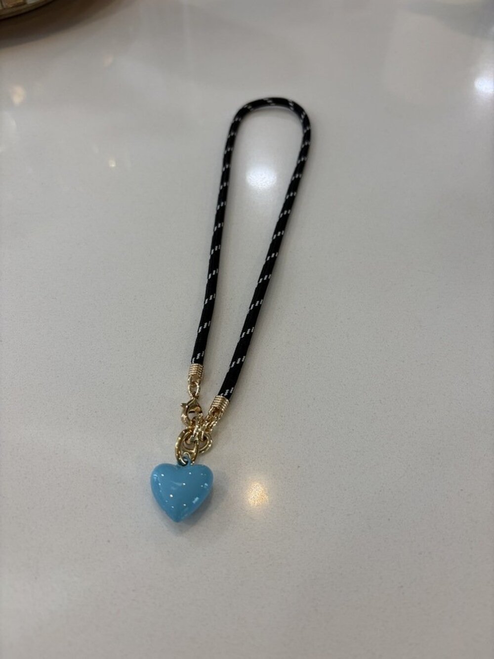 Roxanne Assoulin The Happy Cord Charm Necklace Black Cord Blue Charm